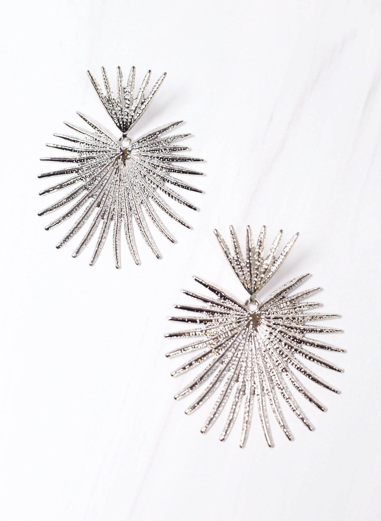 Haris Silver Metal Sunburst Dangle Earrings